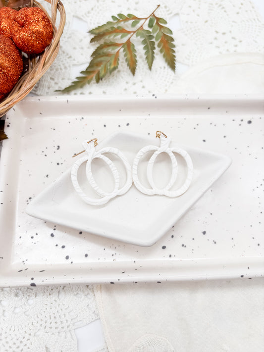 White pumpkin outline with leaf textures