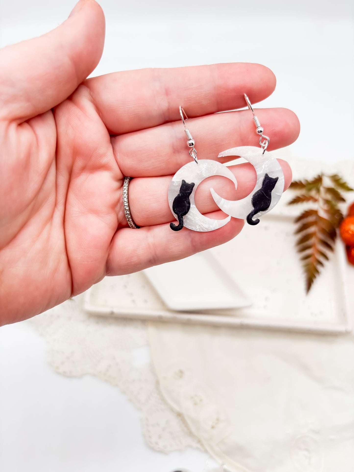 Moon dangles with black cat or dragon
