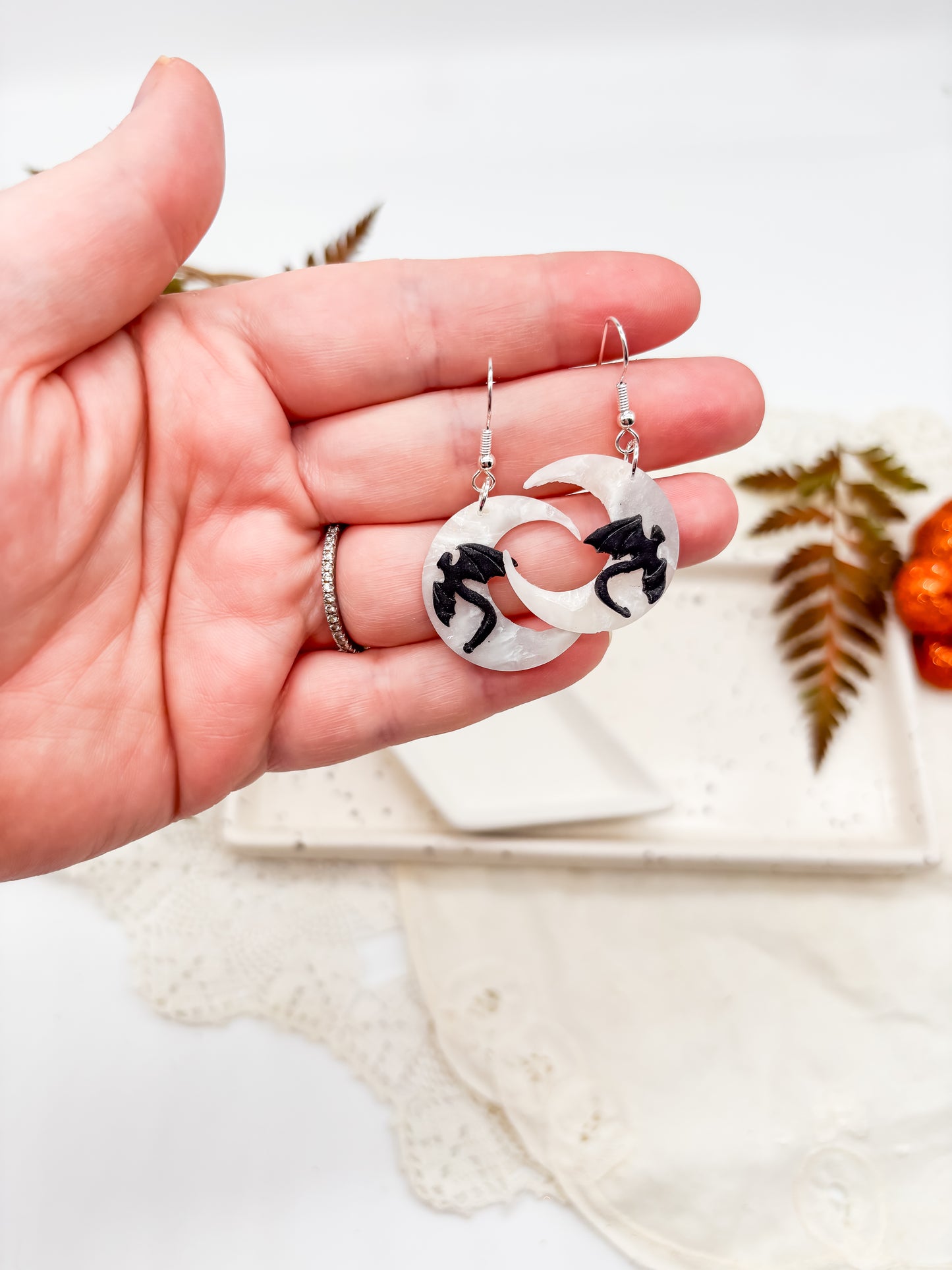 Moon dangles with black cat or dragon