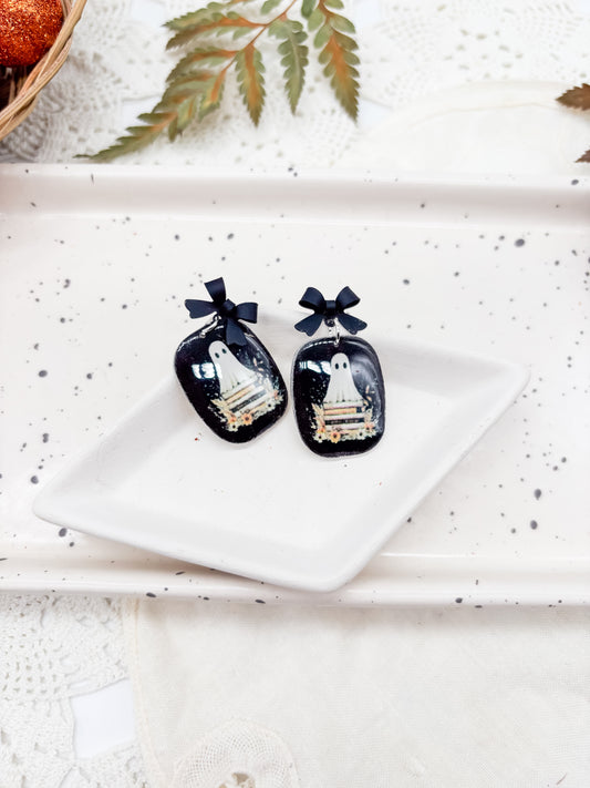 Vintage boho ghosties on book stacks