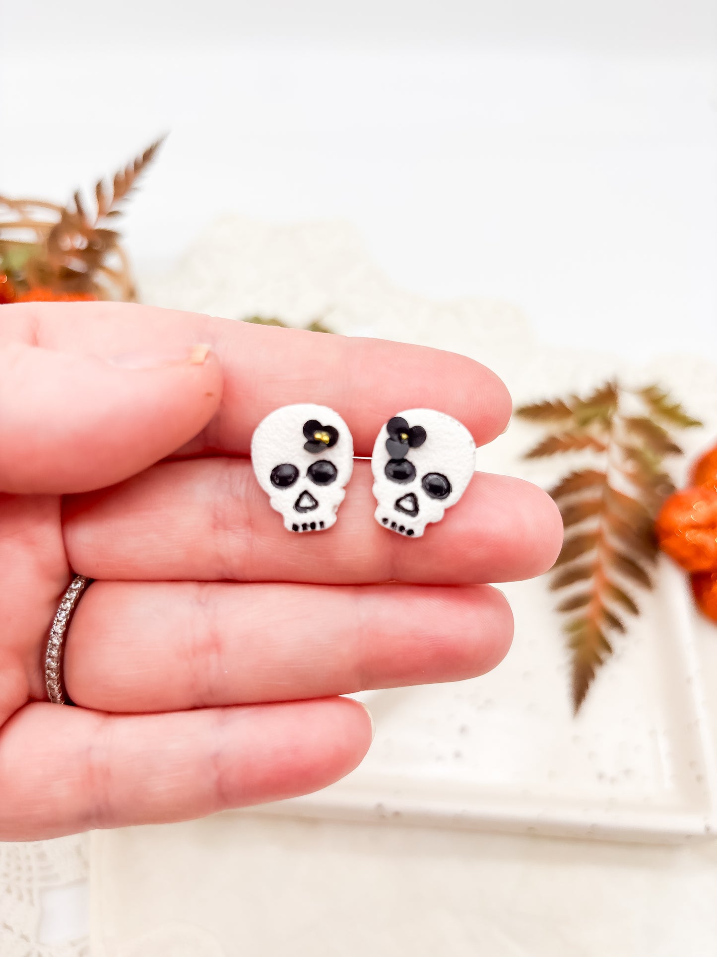 White skull studs