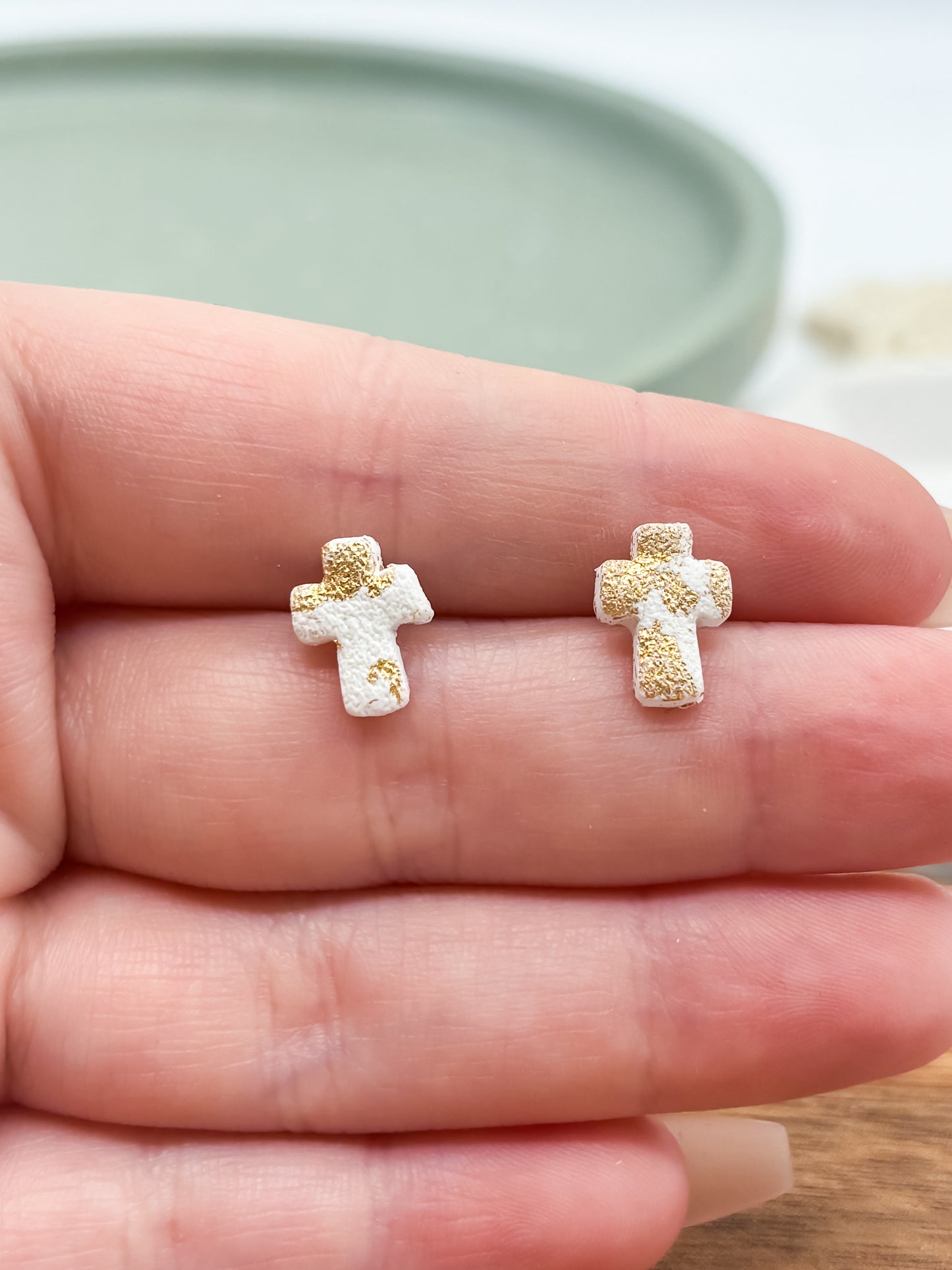 Small gold and white cross stud earrings