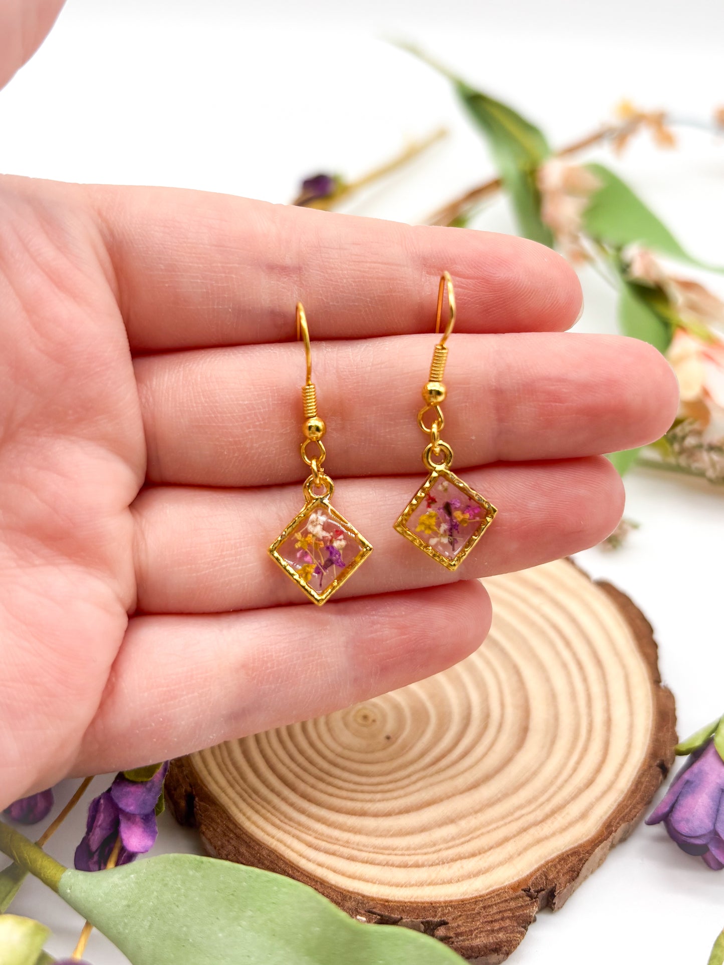 Gold tiny diamond shaped dangles with colorful pressed flowers