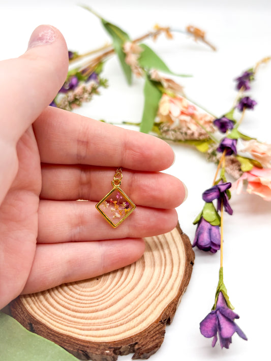 Diamond shaped gold plated necklace with multi colored flowers
