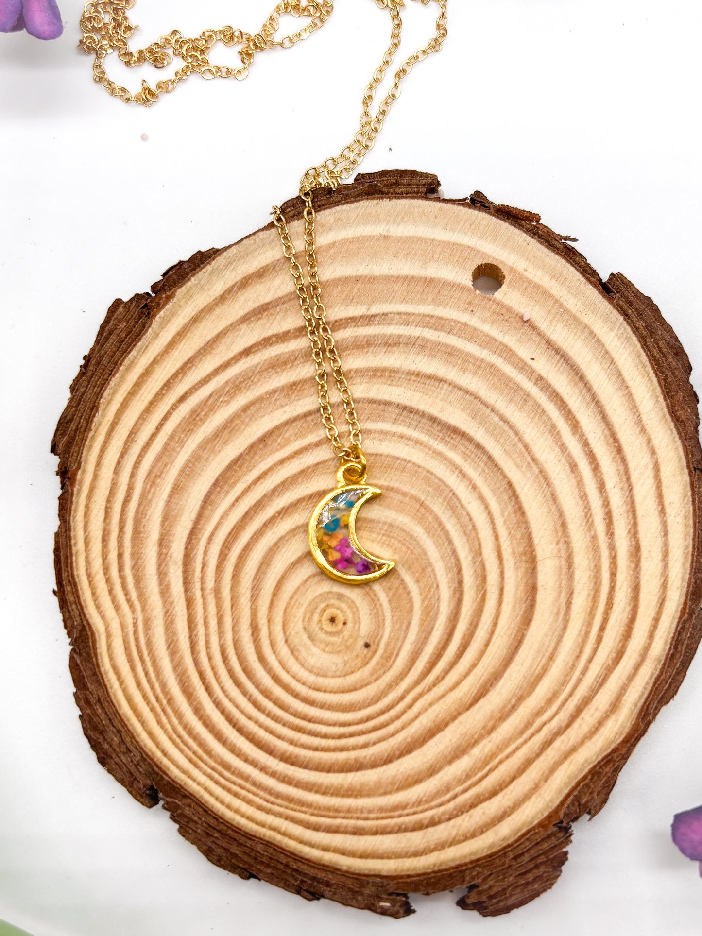 Tiny gold plated moon necklace with tiny multi color flowers