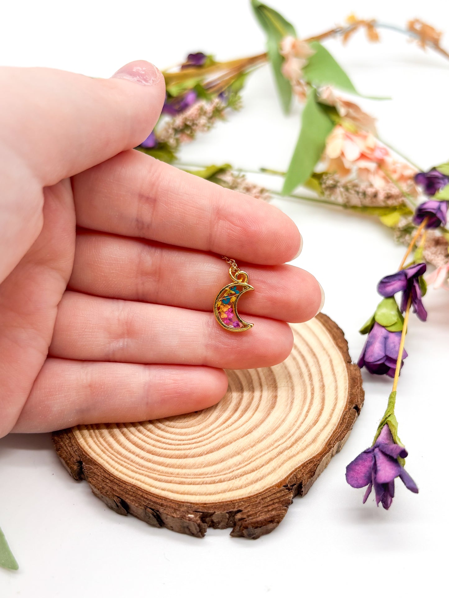 Tiny gold plated moon necklace with tiny multi color flowers