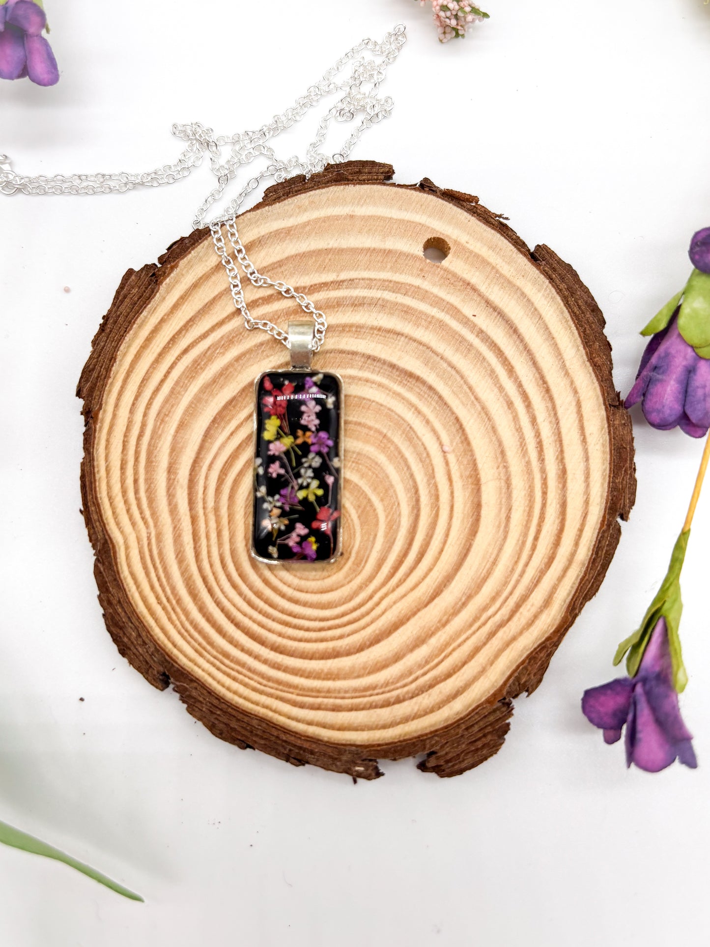 Silver plated necklace with multi color flower pendant