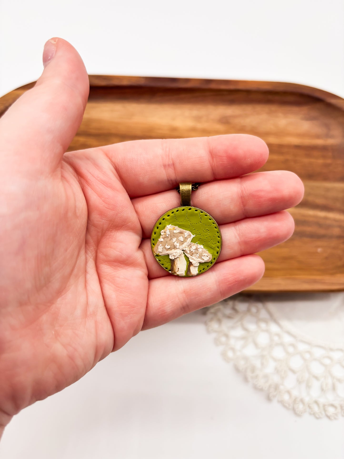 Neutral mushroom on green background necklace