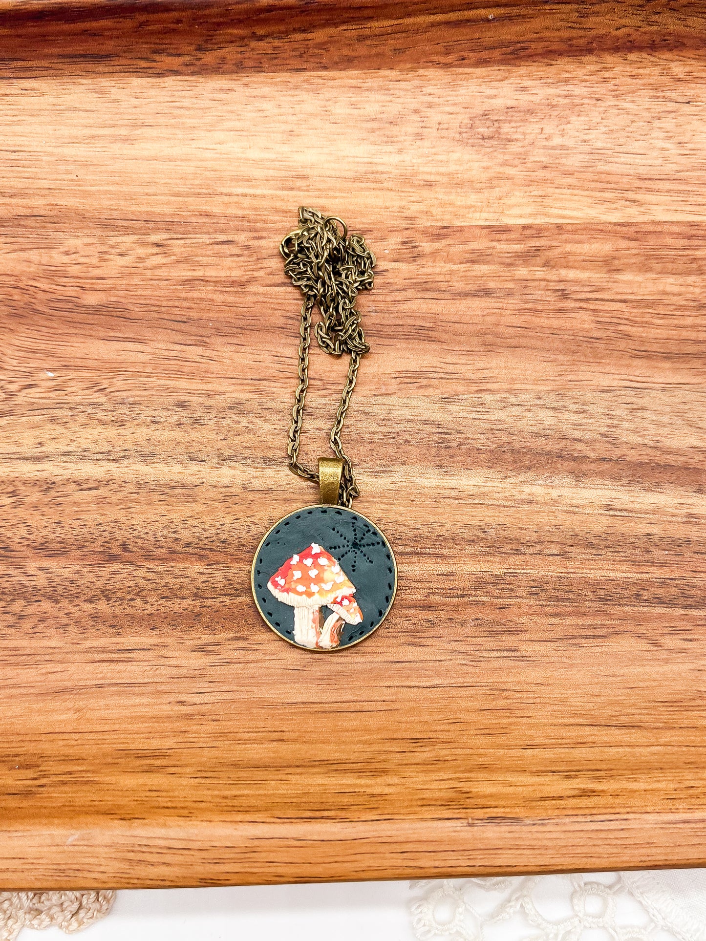 Mushroom necklace on dark background