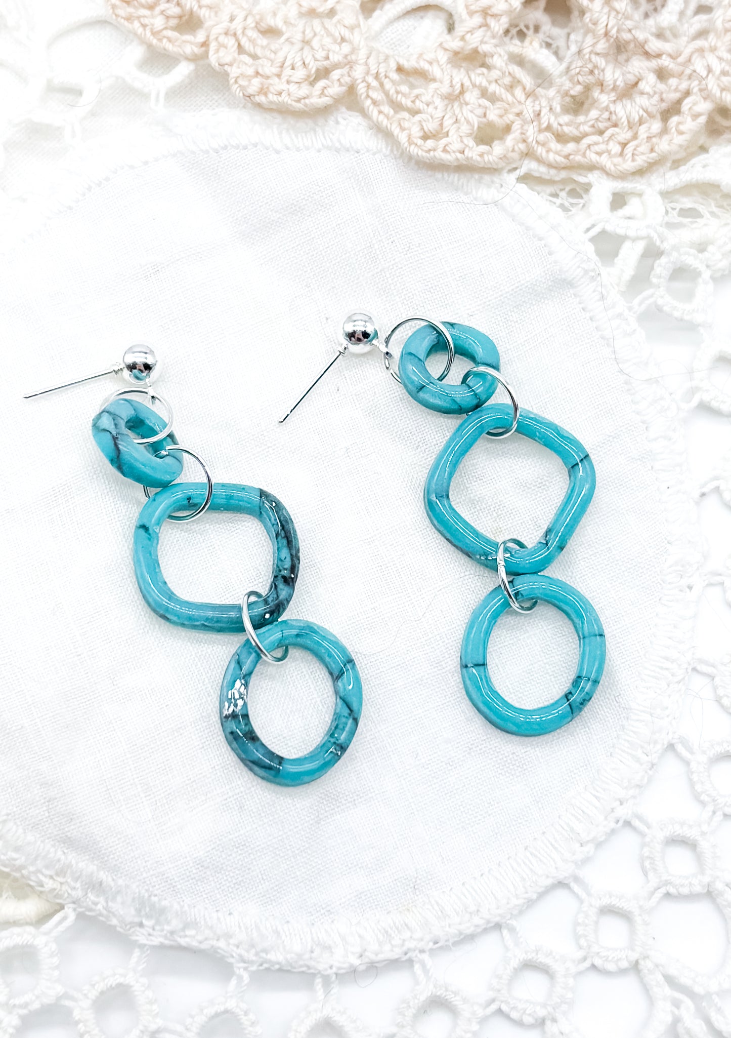 Turquoise dangle in organic outline
