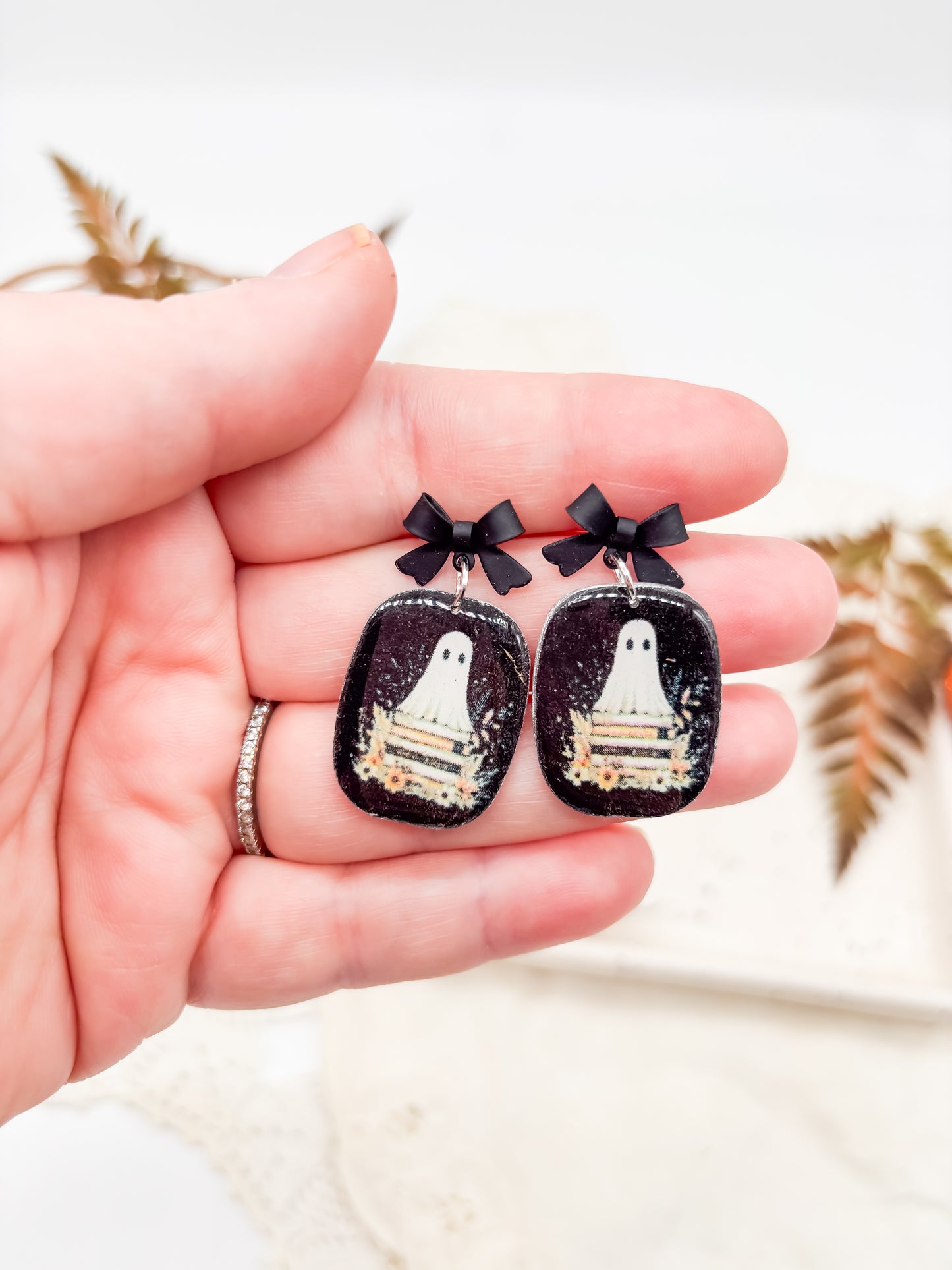 Vintage boho ghosties on book stacks