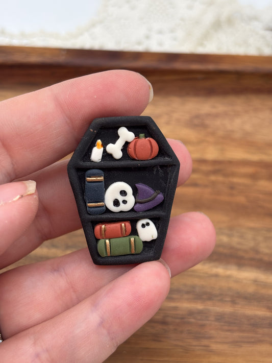 Spooky bookshelf magnet
