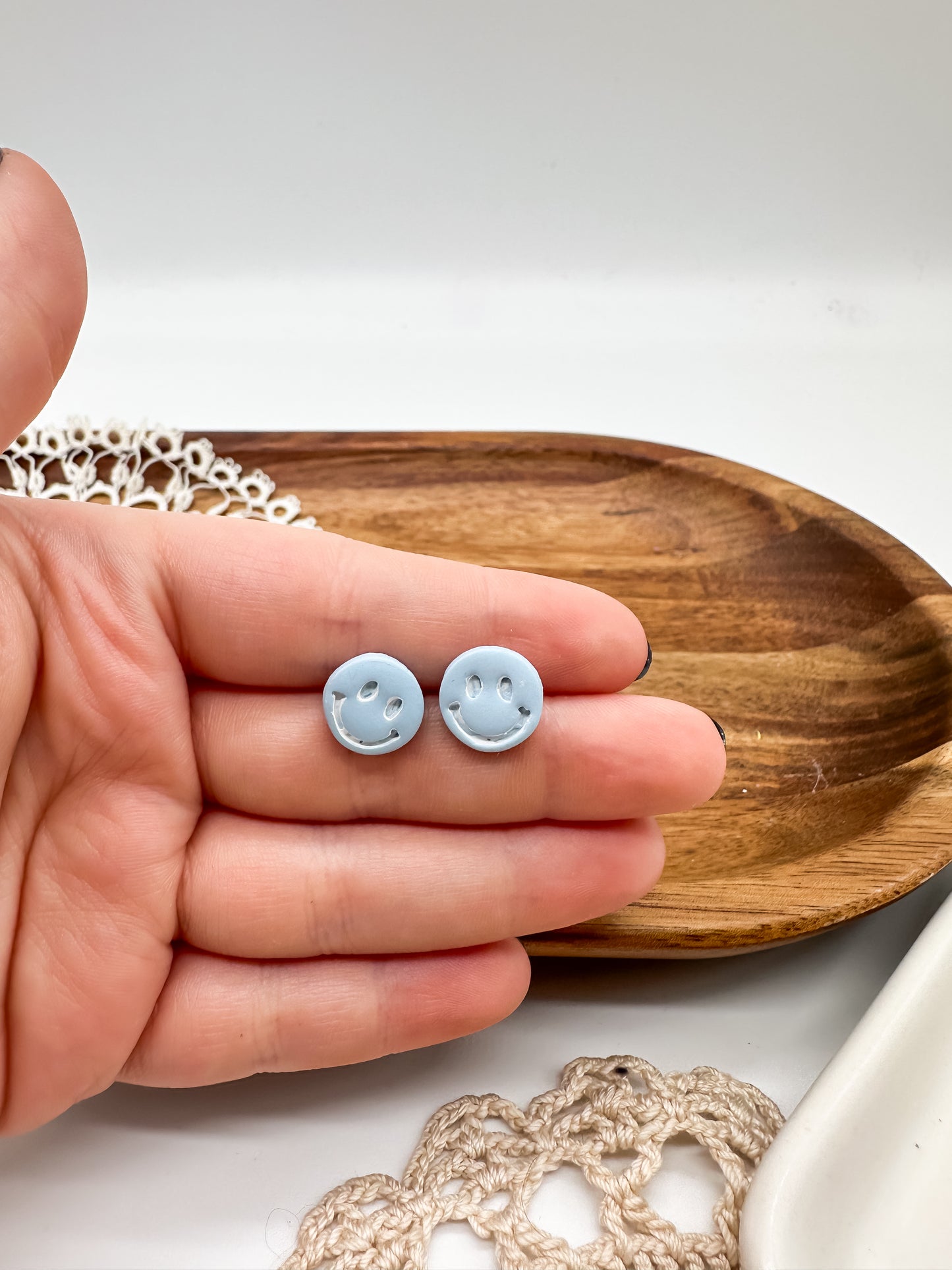 Happy face studs in multiple colors