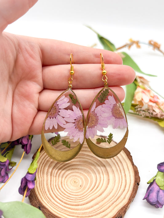 Gold plated teardrop earrings with light purple daisies