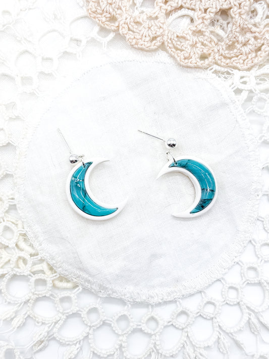 Turquoise moons in white clay bezel